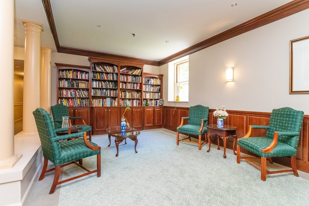 60e Glen Road, Unit 306 Brookline, MA 02445 - Photo 24 of 27 a living room with furniture and a window