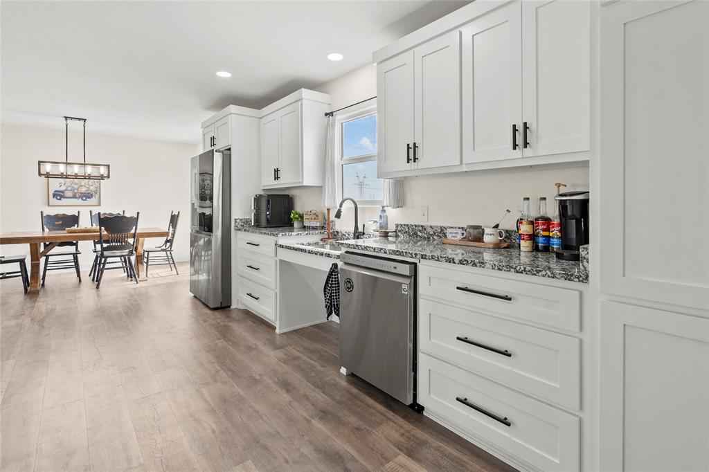 170 Private Road Brookston, TX 75421 - Photo 13 of 33 a kitchen with white cabinets and white appliances