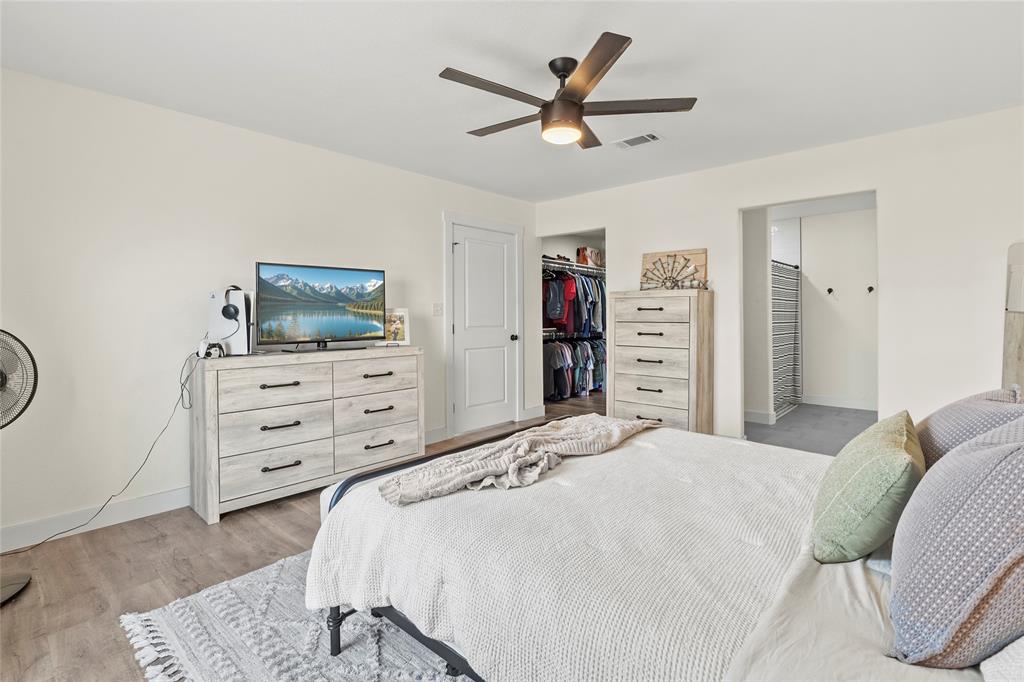 170 Private Road Brookston, TX 75421 - Photo 21 of 33 a bedroom with a bed and a flat screen tv