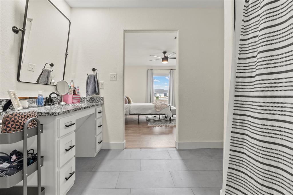 170 Private Road Brookston, TX 75421 - Photo 27 of 33 a bathroom with a granite countertop sink and a mirror