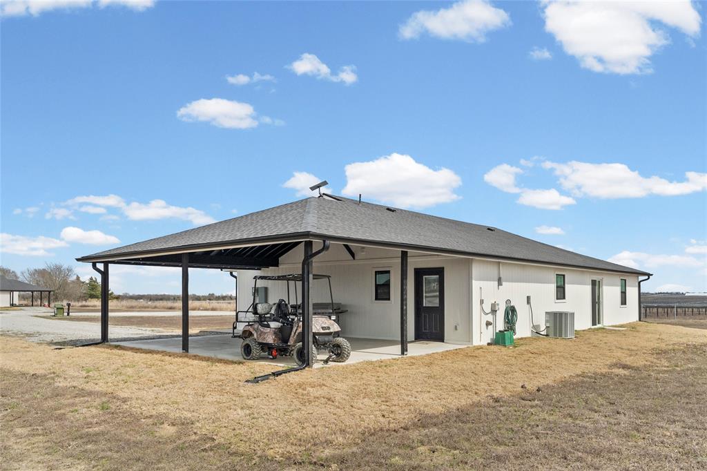 170 Private Road Brookston, TX 75421 - Photo 31 of 33 a view of a house with backyard and porch