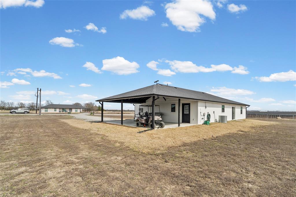 170 Private Road Brookston, TX 75421 - Photo 32 of 33 a view of a house with a yard and wooden fence