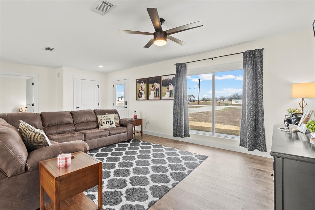 170 Private Road Brookston, TX 75421 - Photo 5 of 33 a living room with furniture and a floor to ceiling window