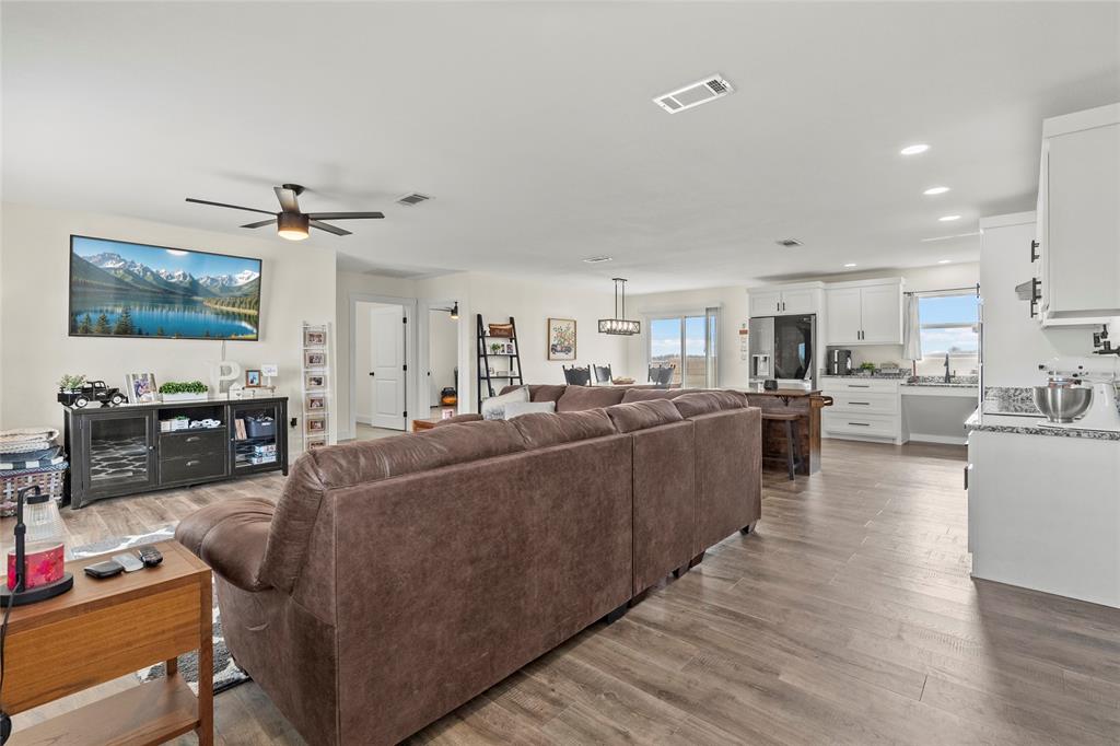 170 Private Road Brookston, TX 75421 - Photo 8 of 33 a living room with furniture kitchen view and a flat screen tv