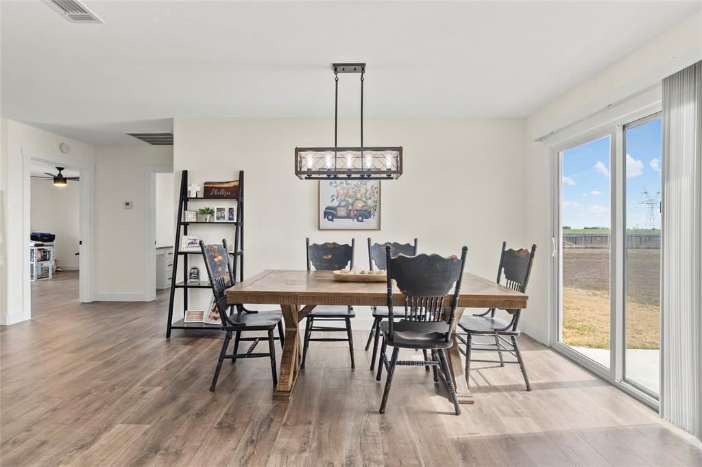 170 Private Road Brookston, TX 75421 - Photo 10 of 33 a view of a dining room with furniture window and wooden floor