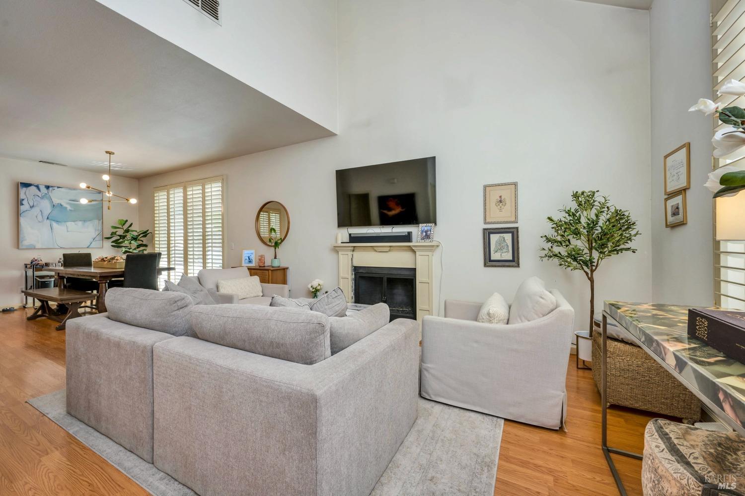 921 Chiles Avenue St. Helena, CA 94574 - Photo 4 of 20 a living room with furniture a fireplace and a potted plant