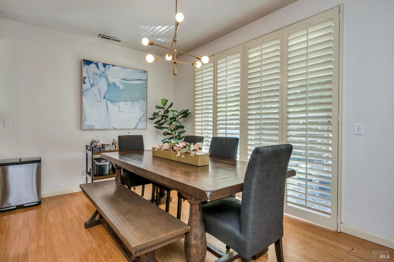 921 Chiles Avenue St. Helena, CA 94574 - Photo 6 of 20 a view of a dining room with furniture window and wooden floor