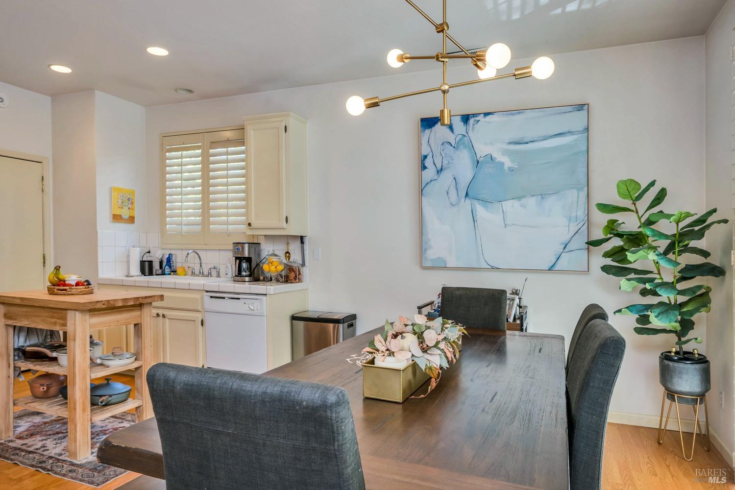 921 Chiles Avenue St. Helena, CA 94574 - Photo 7 of 20 a living room with furniture kitchen view and a chandelier