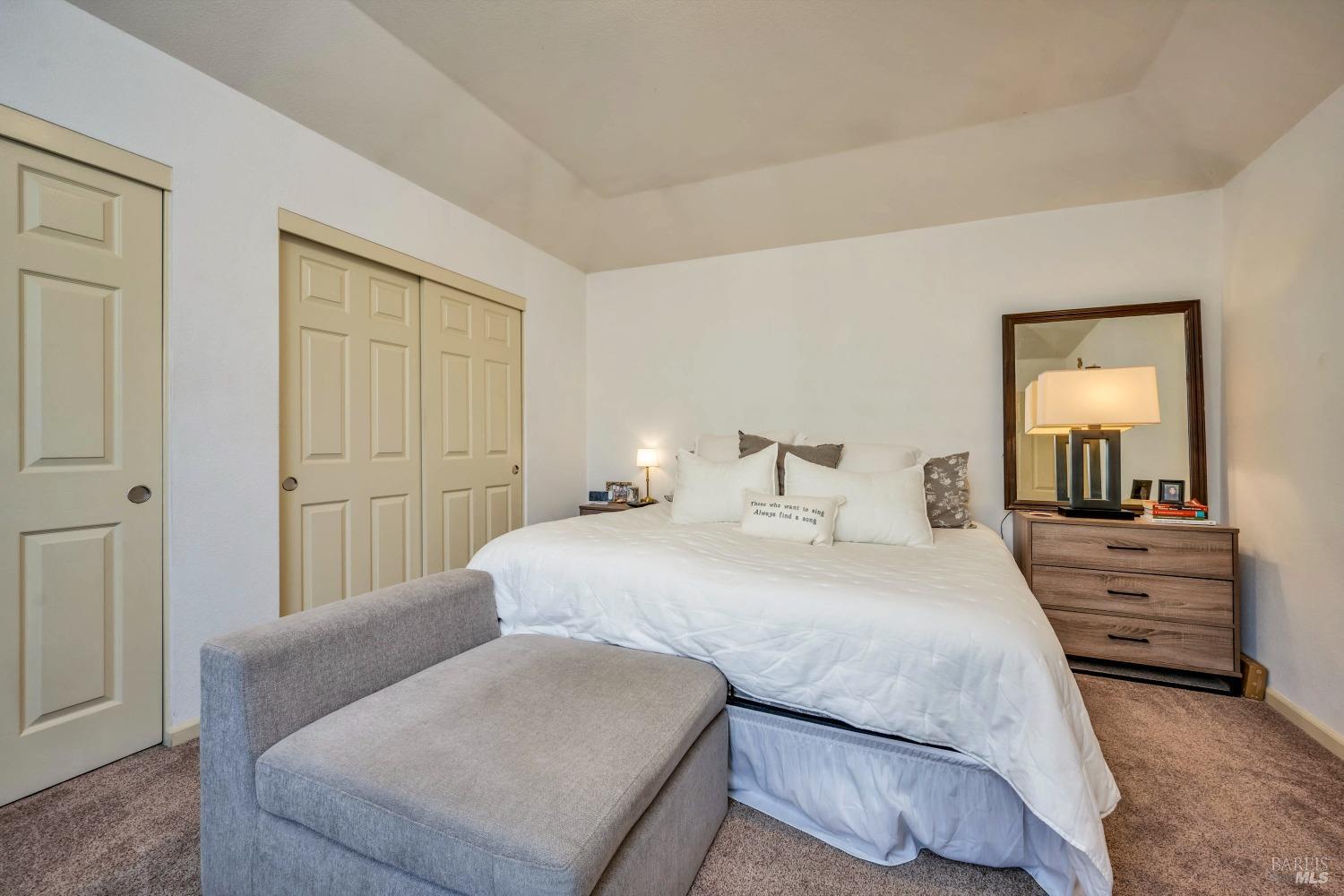 921 Chiles Avenue St. Helena, CA 94574 - Photo 10 of 20 a bedroom with a bed and a dresser