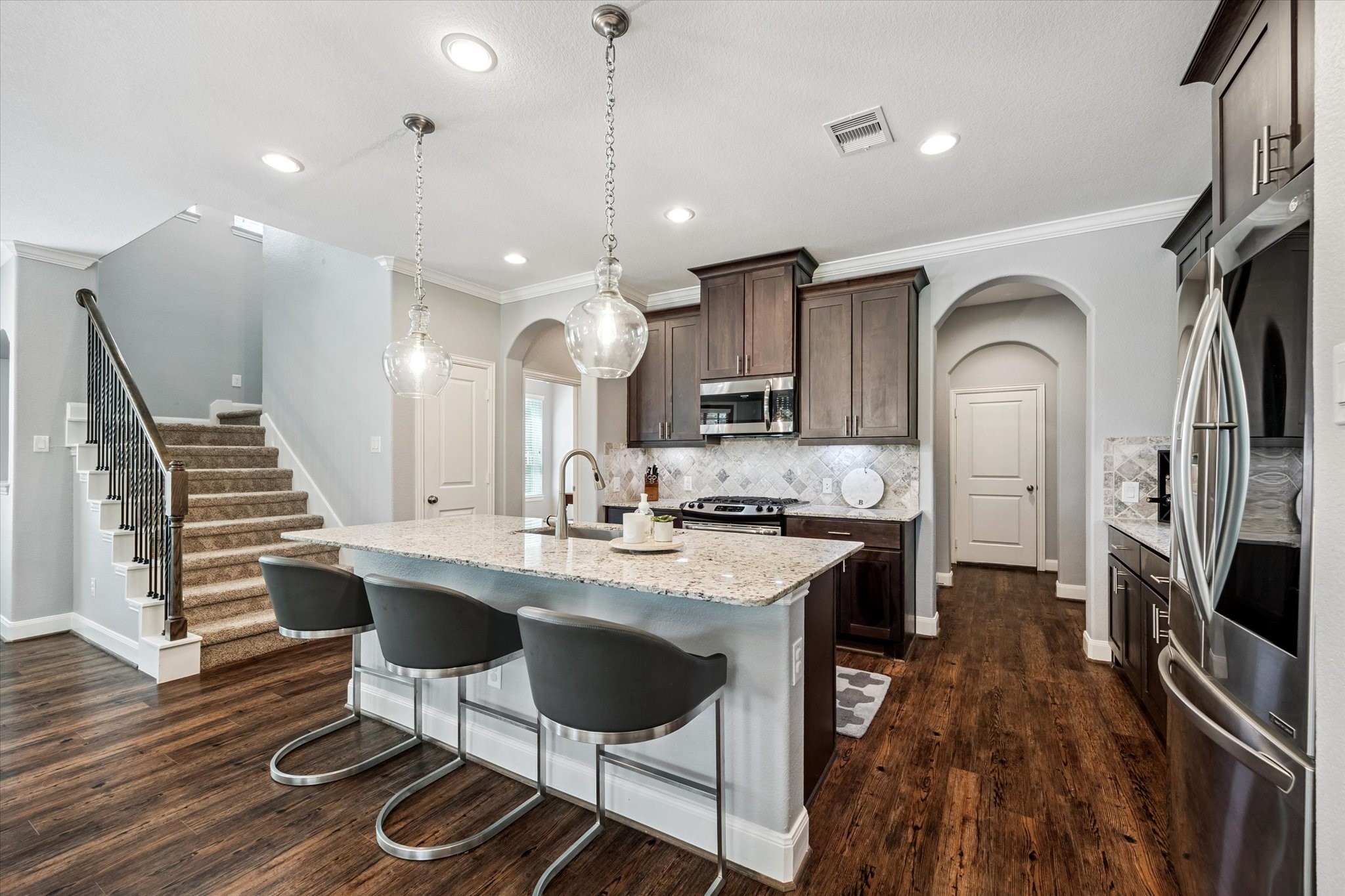 725 Via Lago Drive Webster, TX 77598 - Photo 10 of 30 Hall/mud area leading to pantry and garage