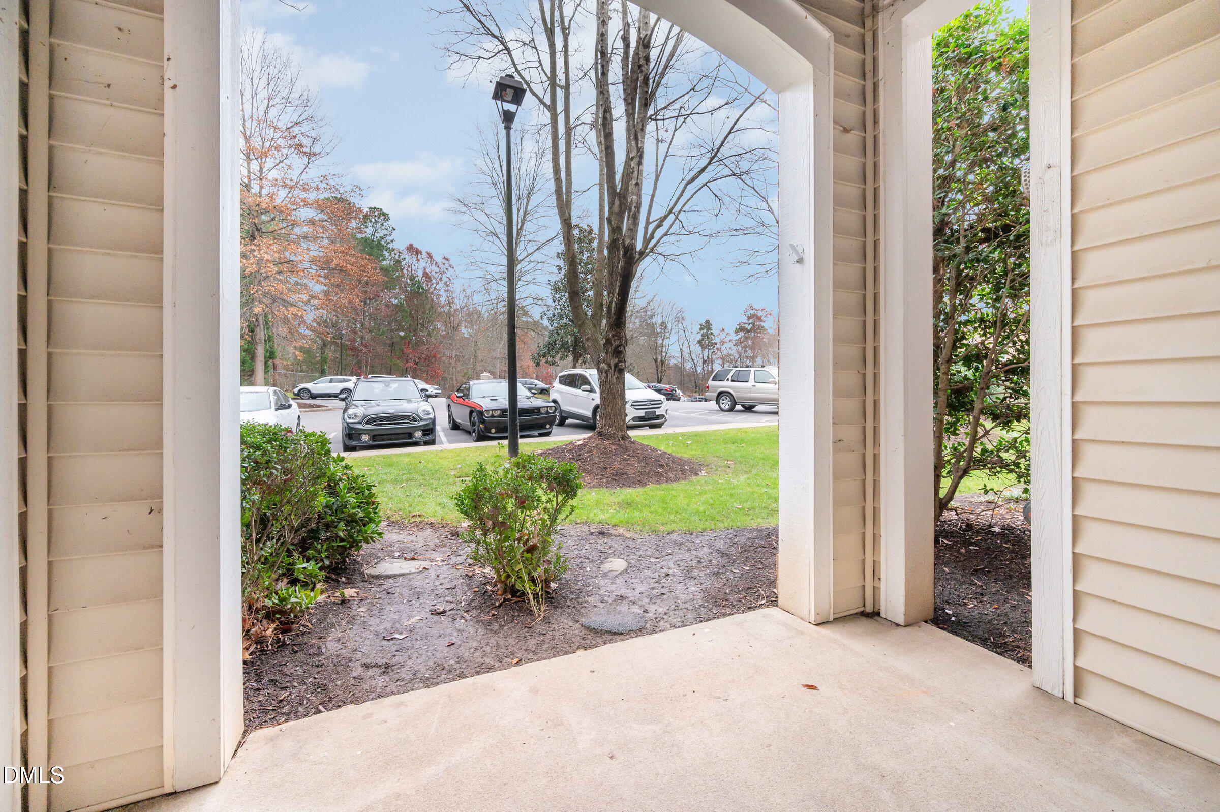 8041 Allyns Landing Way, Unit 101 Raleigh, NC 27615 - Photo 25 of 32 a view of a garden with a fountain