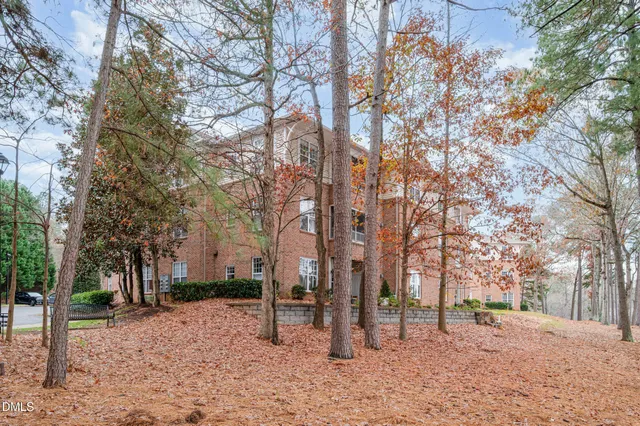 a backyard of a house with lots of trees