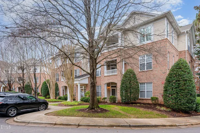 a view of a parked car in front of a building
