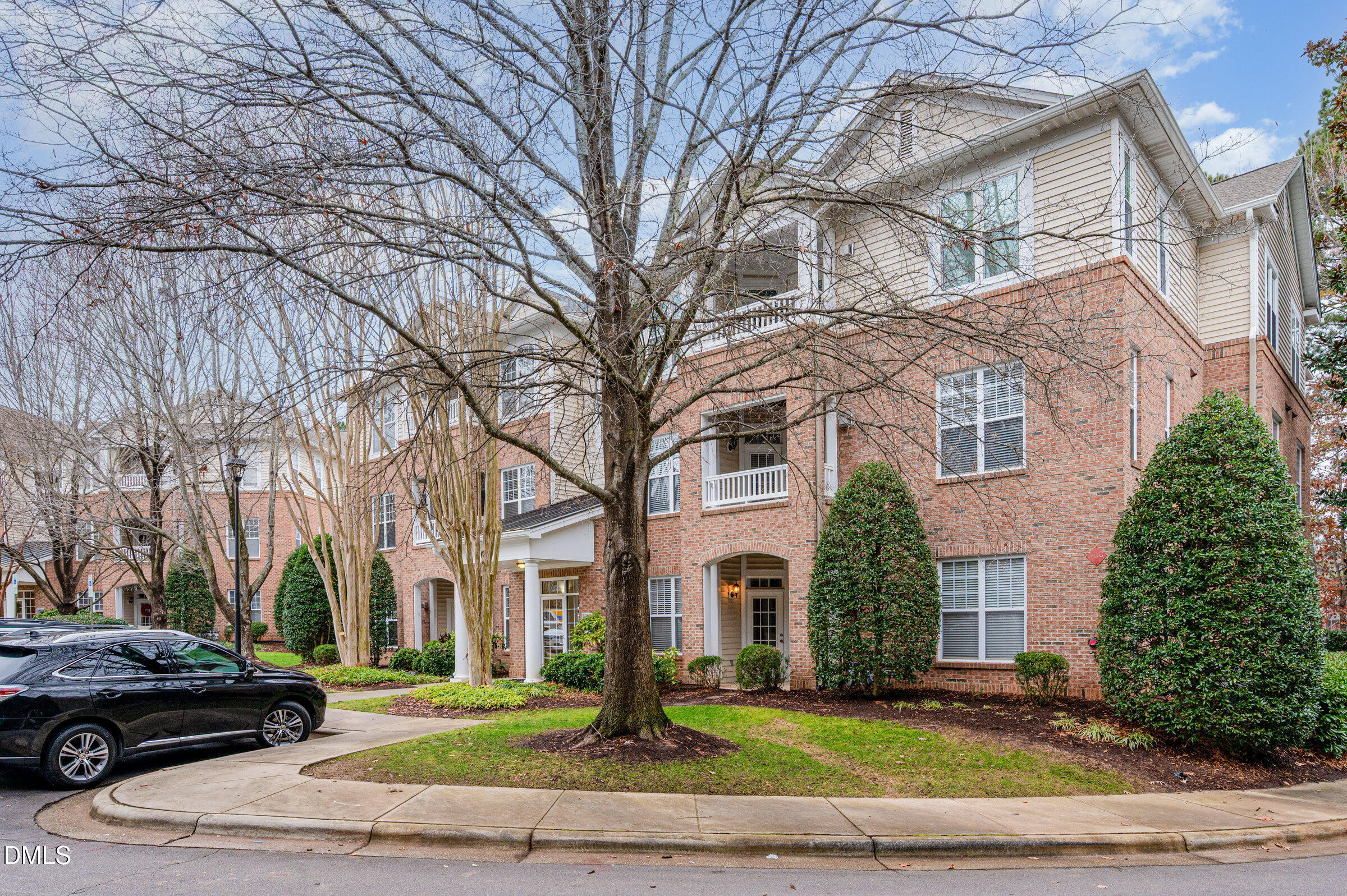 8041 Allyns Landing Way, Unit 101 Raleigh, NC 27615 - Photo 3 of 32 a view of a parked car in front of a building