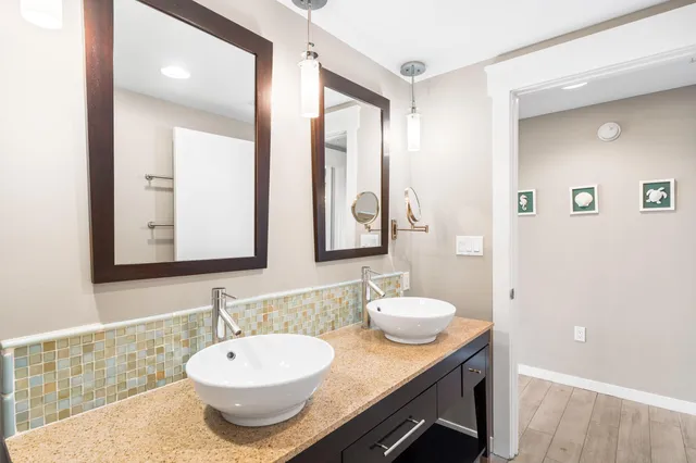 a view of a bedroom with a bed and a window