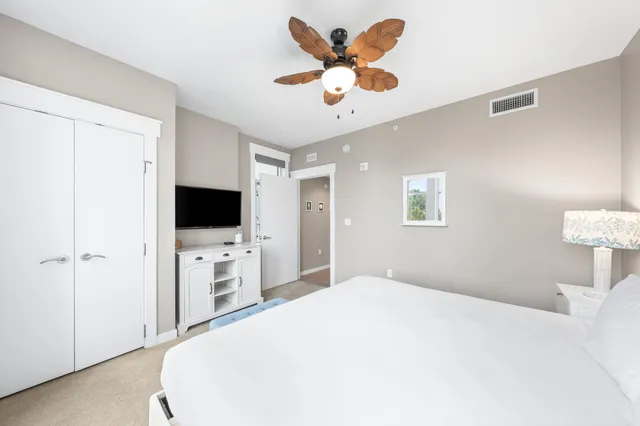 a view of a dining room with furniture and a window