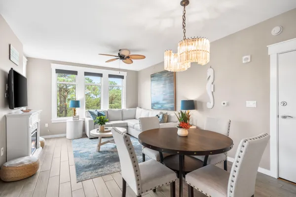 a view of a dining room with furniture window and outside view