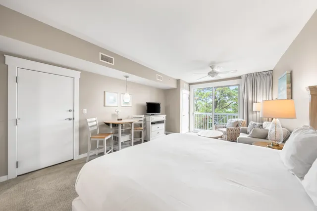 a kitchen with stainless steel appliances granite countertop a sink and a granite counter tops with wooden floors