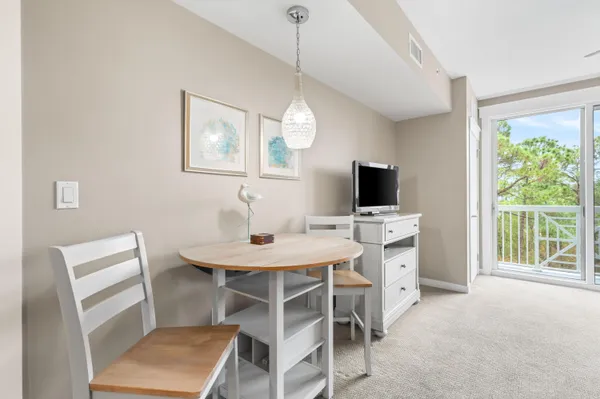 a kitchen with stainless steel appliances kitchen island granite countertop a sink and cabinets
