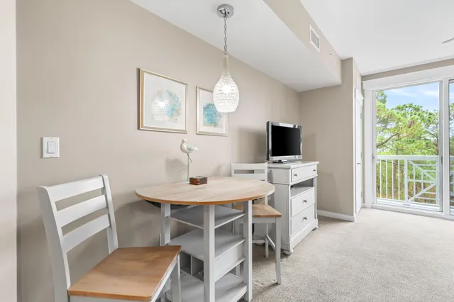 a kitchen with stainless steel appliances kitchen island granite countertop a sink and cabinets
