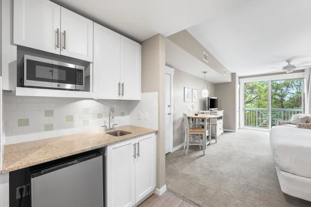 a view of a water fountain and tall buildings