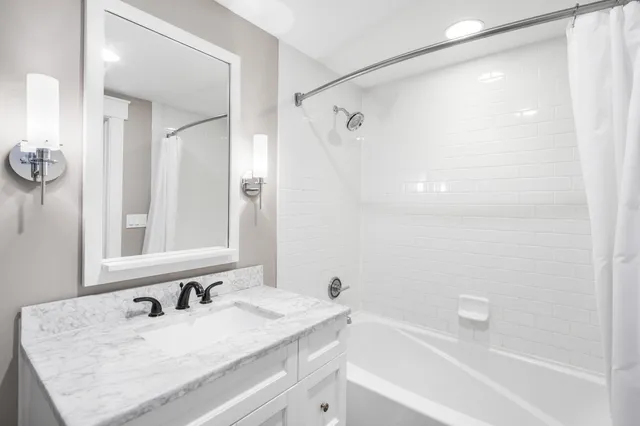 a view of a swimming pool with lounge chairs