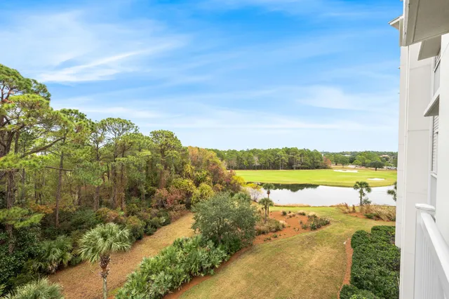 a view of swimming pool with outdoor seating and plants