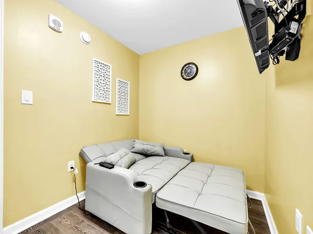 a living room with a bed and a couch