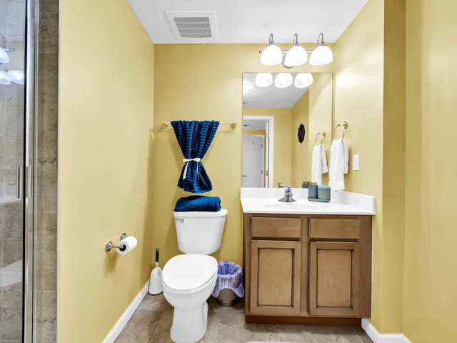 a bathroom with a shower and a sink