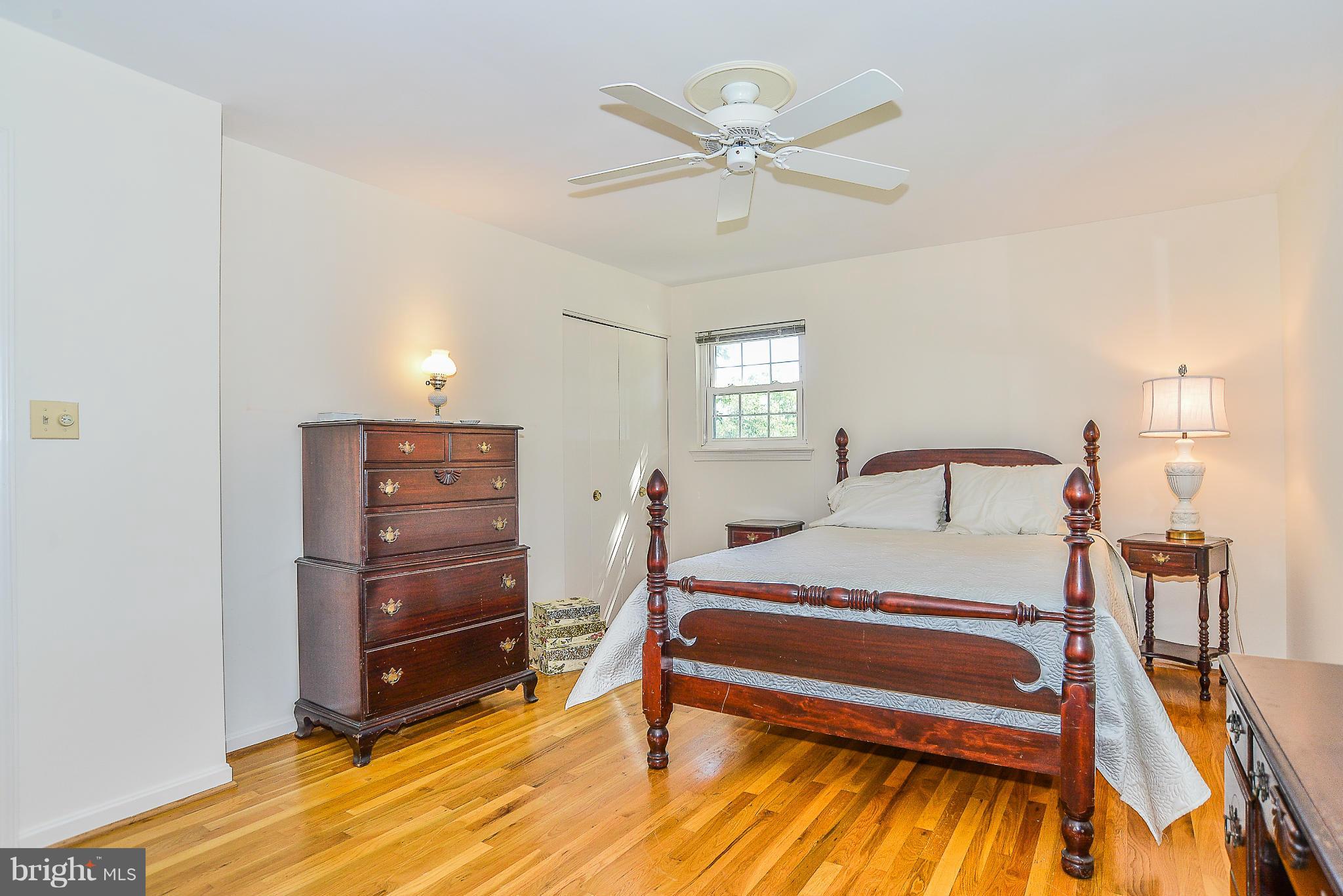 6000 Filbert Court Springfield, VA 22152 - Photo 15 of 21 a bedroom with a bed and a chandelier