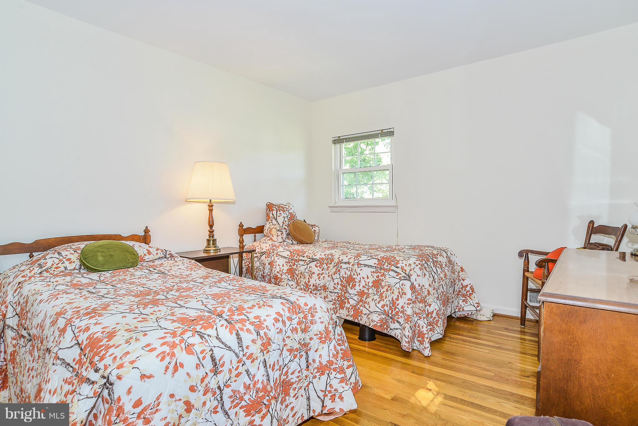 6000 Filbert Court Springfield, VA 22152 - Photo 17 of 21 a bedroom with two beds and a lamp on the dresser