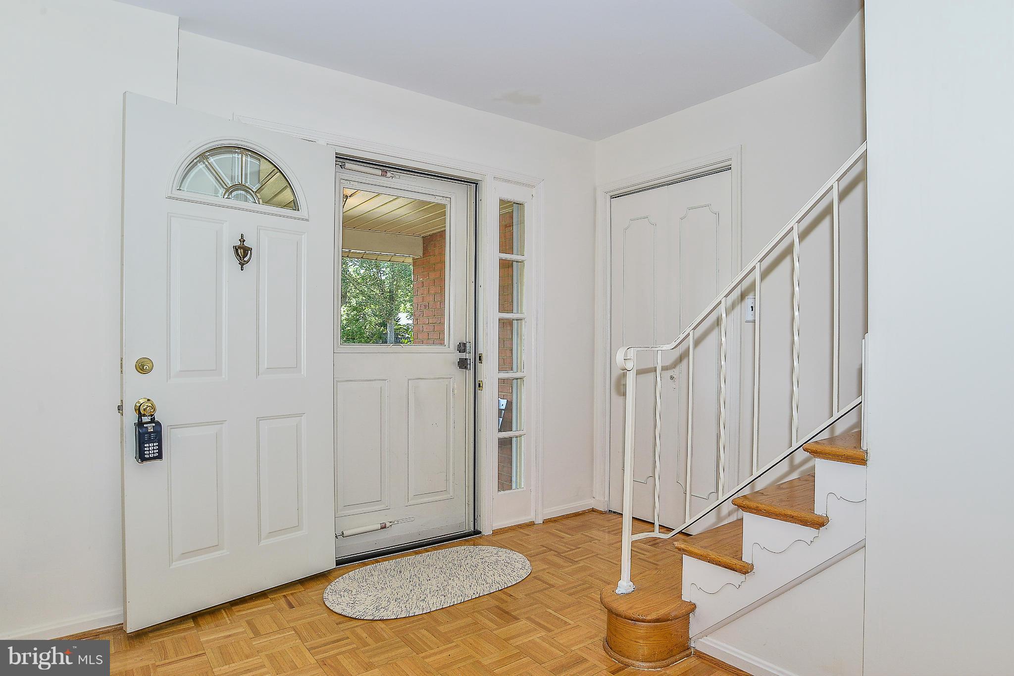 6000 Filbert Court Springfield, VA 22152 - Photo 3 of 21 a view of entryway with wooden floor