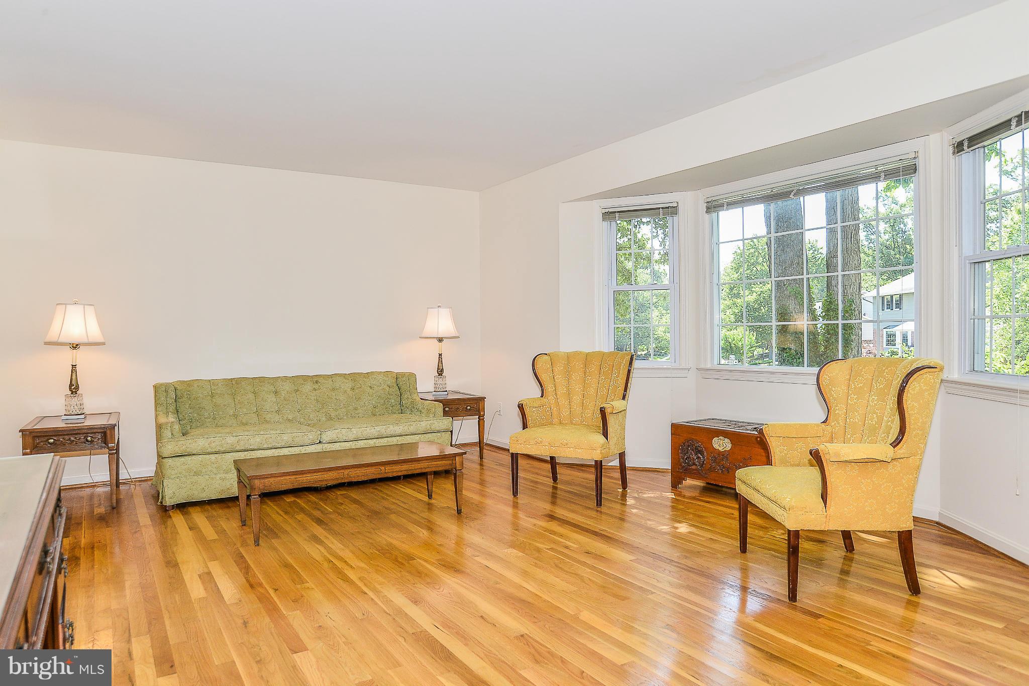 6000 Filbert Court Springfield, VA 22152 - Photo 4 of 21 a living room with furniture and a large window