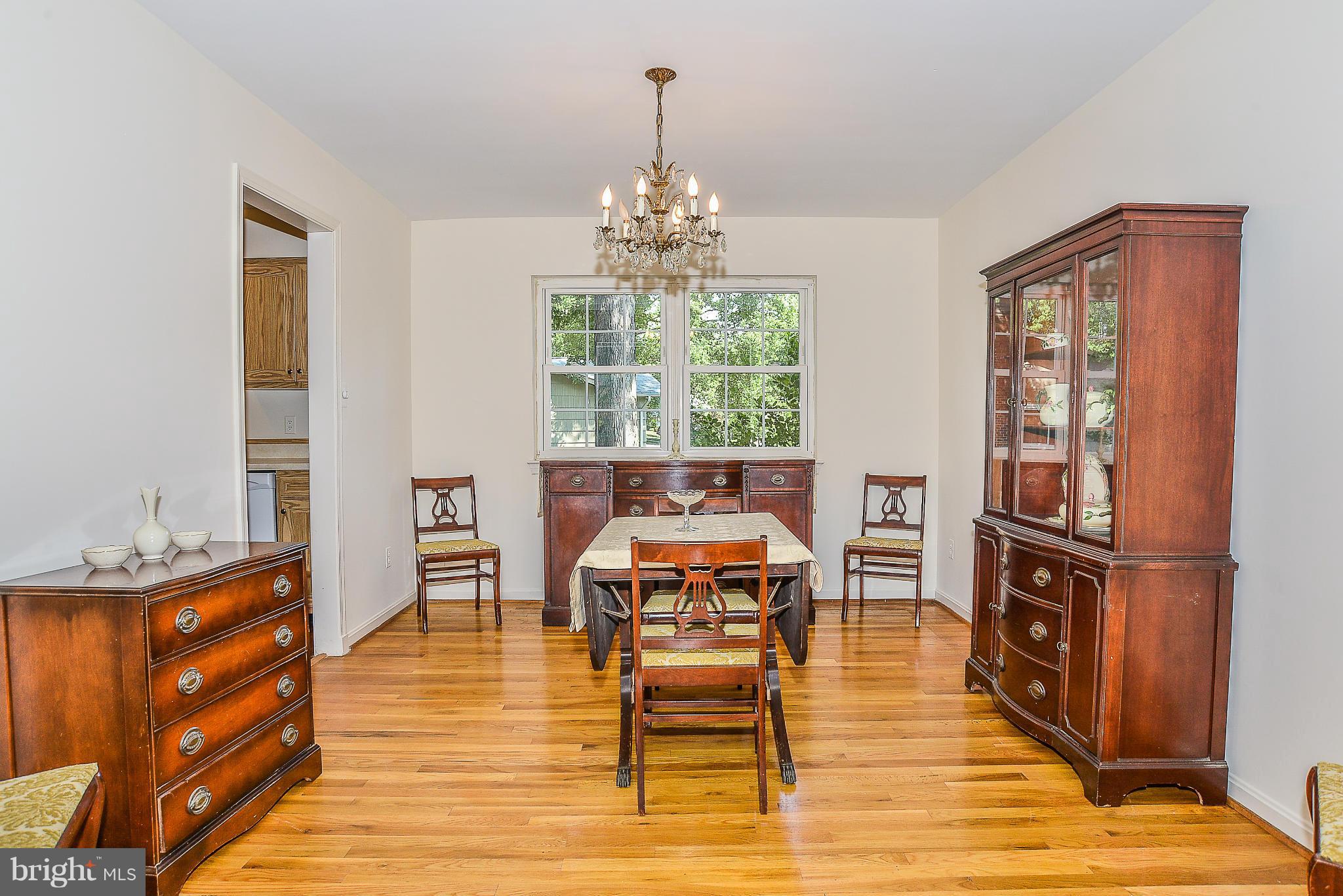 6000 Filbert Court Springfield, VA 22152 - Photo 6 of 21 a living room with furniture and a wooden floor