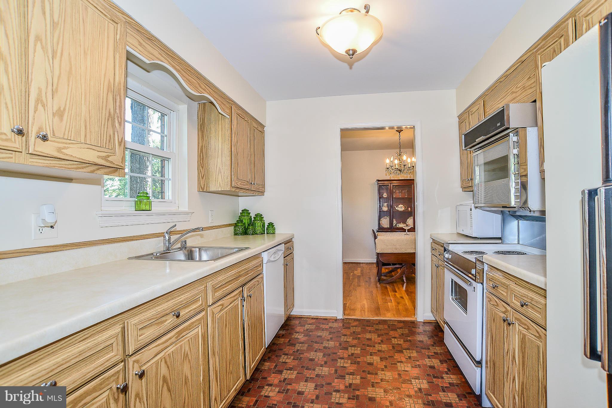 6000 Filbert Court Springfield, VA 22152 - Photo 8 of 21 a kitchen with a sink and cabinets