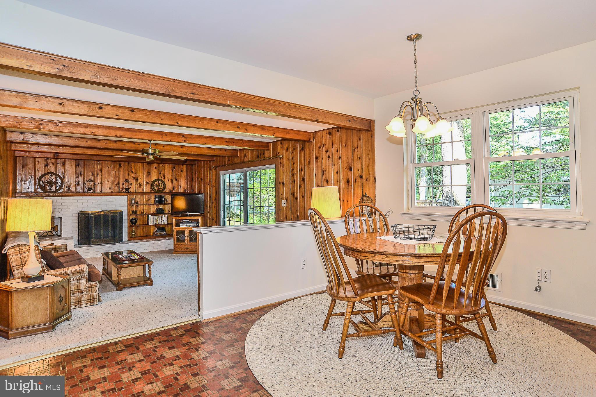 6000 Filbert Court Springfield, VA 22152 - Photo 10 of 21 a dining room with furniture a chandelier and wooden floor