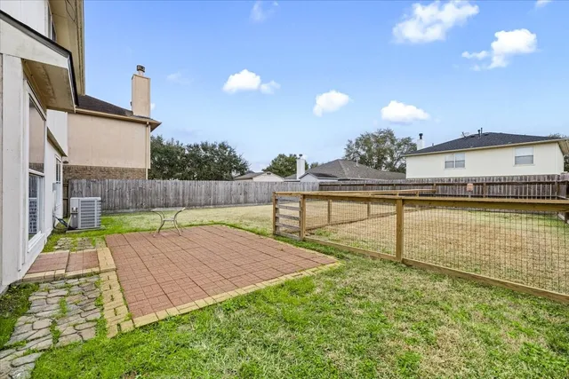 a view of a backyard with a swimming pool