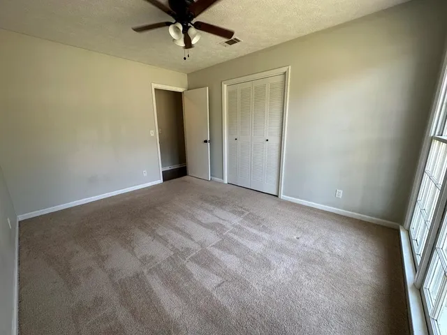 a view of empty room with a window