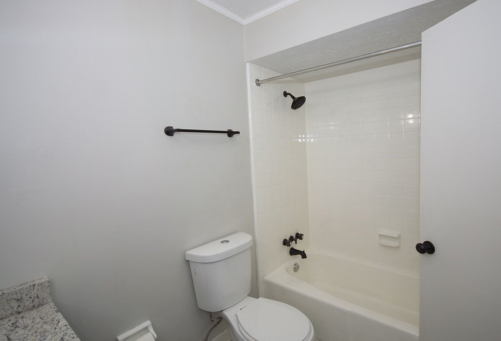 6838 Buckeye Way Columbus, GA 31904 - Photo 28 of 34 a bathroom with a toilet and a shower