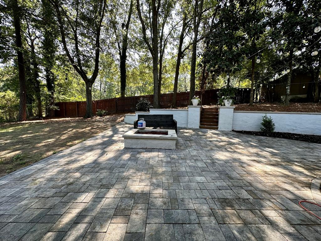 6838 Buckeye Way Columbus, GA 31904 - Photo 32 of 34 a bench is sitting in the middle of a yard