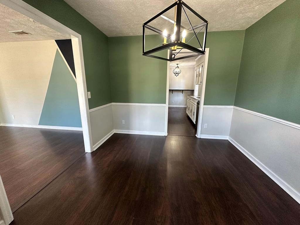 6838 Buckeye Way Columbus, GA 31904 - Photo 7 of 34 a view of entryway and hall with wooden floor
