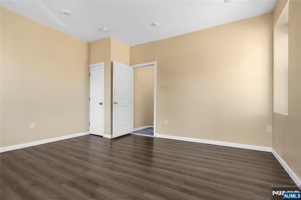 183 Bergen Turnpike Ridgefield Park, NJ 07660 - Photo 14 of 18 a view of an empty room with wooden floor