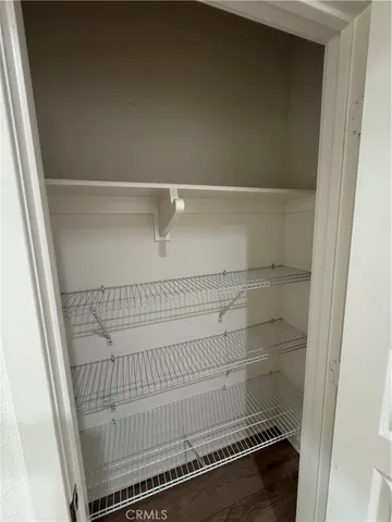 a bathroom with a granite countertop toilet a sink and a mirror