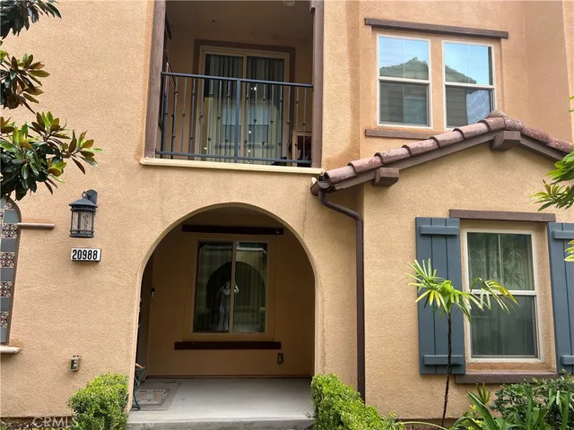 a front view of a house with large windows