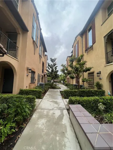a view of a pathway with a house in the background