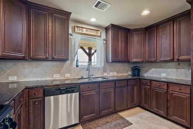 a view of a refrigerator in kitchen and wooden floor