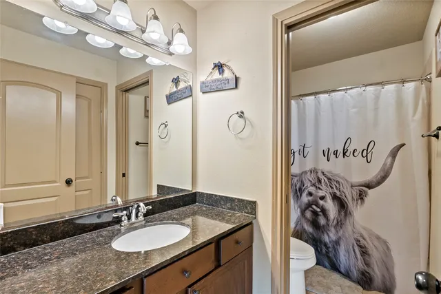 a living room with a bed furniture and a large window