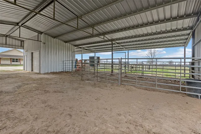 an aerial view of residential houses with outdoor space and street view