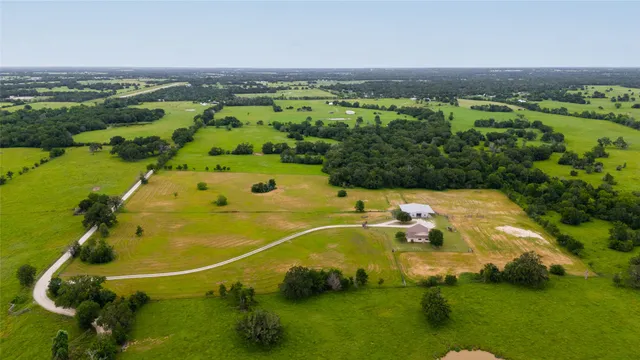 a view of a lake with houses in the background