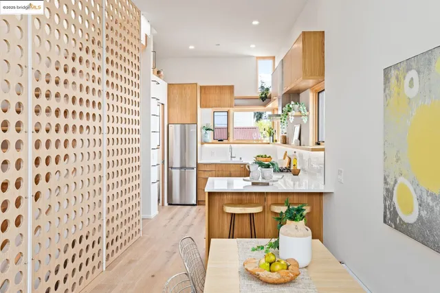 a dining room with a table and chairs